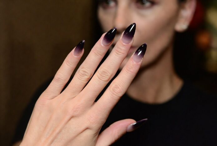 Charlize Theron Dark Manicure Starts New Spring Trend