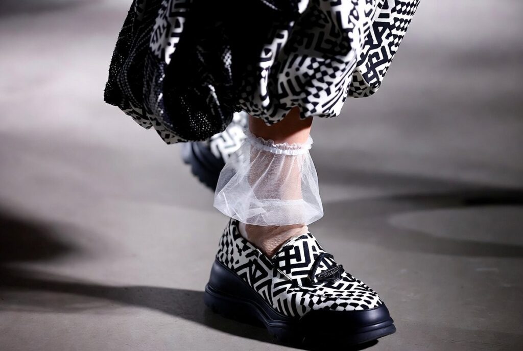 Miuccia Prada’s “Ugly Chic” Aesthetic Sparks Debate Across Fashion Week