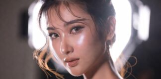 Model wearing Charlotte Tilbury Airbrush Flawless Foundation with modern skin-first makeup styling