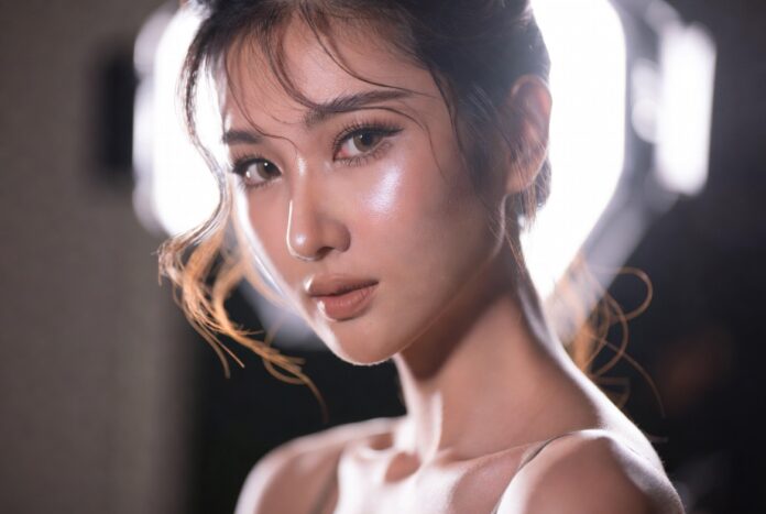 Charlotte Tilbury Airbrush Flawless Foundation and 2026 Skin Trends Model wearing Charlotte Tilbury Airbrush Flawless Foundation with modern skin-first makeup styling