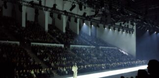 Model walking a runway at a major international fashion week show, representing the complete global fashion week calendar 2026 coverage guide by Runway Magazine