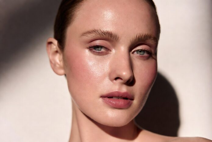 Editorial beauty image inspired by Rhode Beauty’s soft-blush makeup trend and creamy Pocket Blush collection