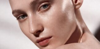 Model with glowing hydrated skin inspired by Rhode Glazing Milk serum