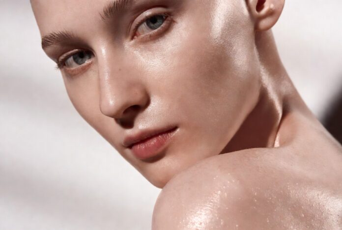 Model with glowing hydrated skin inspired by Rhode Glazing Milk serum Model with glowing hydrated skin inspired by Rhode Glazing Milk serum