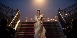 Zendaya Style Archive: Every Major Look, 2015–2026 A figure in a sculptural custom couture gown on a red carpet representing Runway Magazine's complete Zendaya style archive documenting every major look from 2015 to 2026