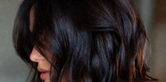 The Espresso Bob Is Becoming Summer’s Most Requested Celebrity Haircut Woman with rich glossy dark espresso brunette long bob haircut representing the most requested celebrity haircut trend of summer 2026 evoking Katie Holmes hair and the luxury hair trends and glossy brunette hair aesthetic driving salon bookings in 2026