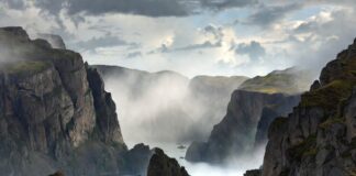 How to Train Your Dragon Continues Winning Over Summer Audiences Dramatic coastal cliffs and misty fjords evoking the fantasy adventure world of the live-action How to Train Your Dragon 2025 directed by Dean DeBlois representing the DreamWorks family blockbuster that earned 636 million dollars worldwide